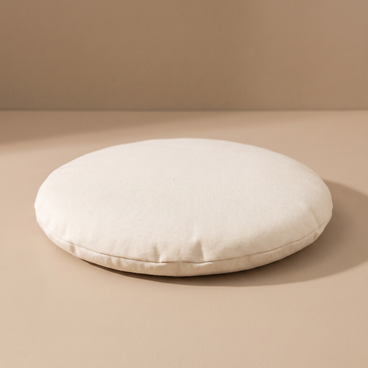 The round cream comfort cushion that comes inside every Claw Basket